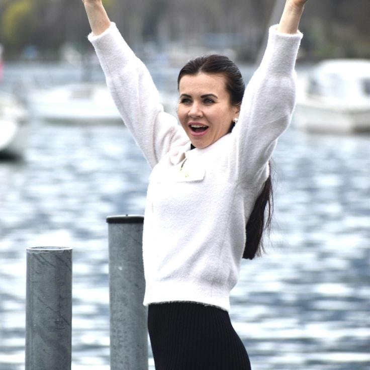 Kaveri Mehta, Lead Design Curator at SpringsMosaicRiver, reviewing corporate floral arrangements